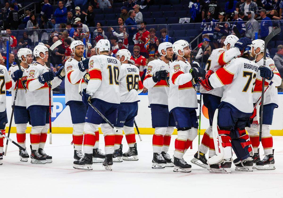 Florida Panthers players celebrate with goaltender Sergei Bobrovsky (72) after defeating the Tampa Bay Lightning 6-3 in game 5 of the first round of the Stanley Cup Playoffs set Amalie Arena on Wednesday, April 30, 2025, in Tampa.