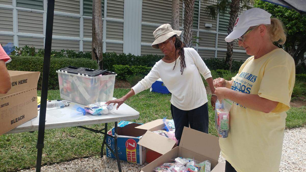 Liz Levi, left, and Mary Simmons sort through donations of toiletries destined for Green Turtle Cay in the Bahamas.
