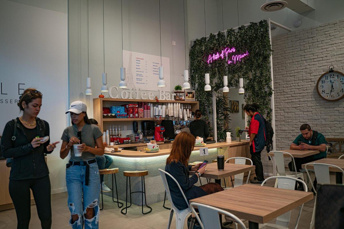 Customers at Ficelle bakery inside River Landing probably don’t know the owner’s unique story.