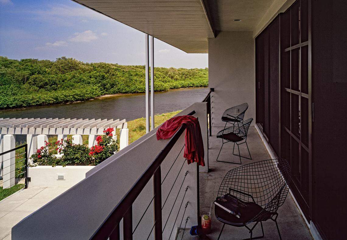 Deep overhangs shade the windows and sliding glass doors of this house in Punta Gorda designed by Suzanne Martinson.