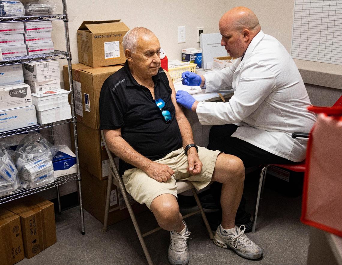Eduardo Corcharo receives his influenza vaccine from Pharmacist Ivan during CDC Director Many Cohen’s visit to CVS Pharmacy on Monday, Oct. 16, 2023, located on SW 40th Street in Miami.