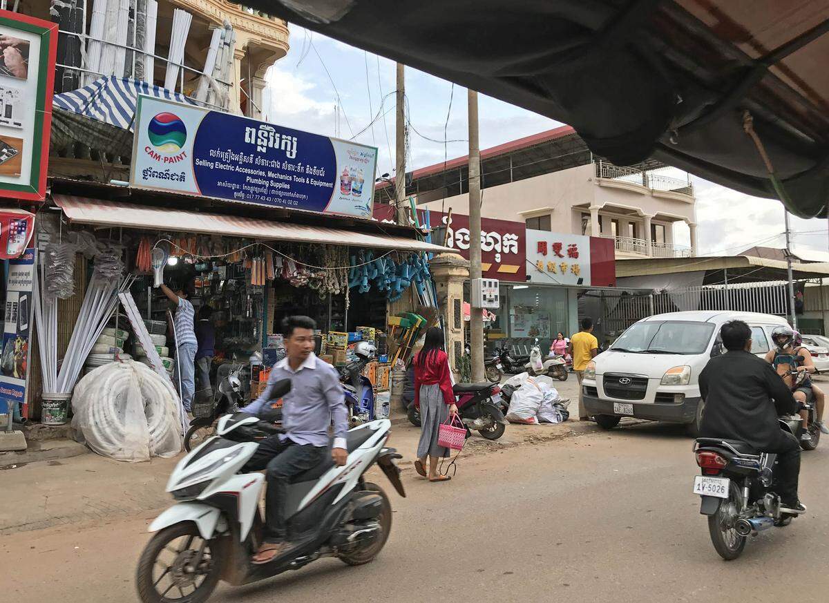 Motorbikes on a shopping street in Siem Reap, Cambodia.