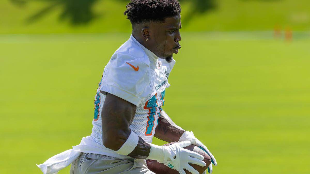 Miami Dolphins wide receiver Tyreek Hill runs after catching a pass during team practice on Sept. 11, 2024, in Miami Gardens.