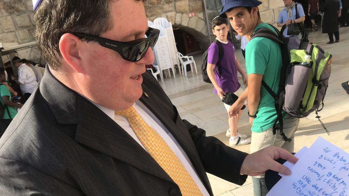 Rep. Randy Fine, R-Melbourne Beach, shows the letter his son wrote to put onto the Wailing Wall.