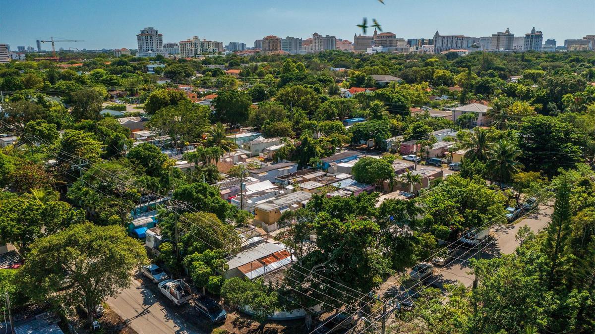 Home prices rose again in South Florida for the month of October, according to the Miami Association of Realtors’ latest monthly residential reports. Above: View of the Coral Gables skyline in the distance and trailer homes at the Gables Trailer Park.
