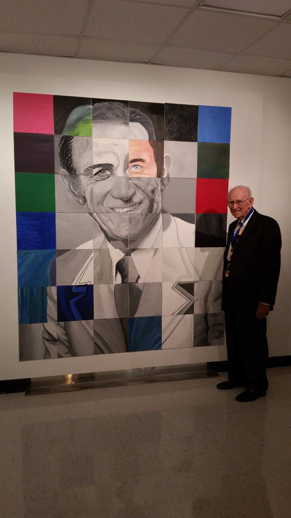 G. Holmes Braddock stands in front of a mural done of him at G. Holmes Braddock Senior High in Kendall in 2015.
