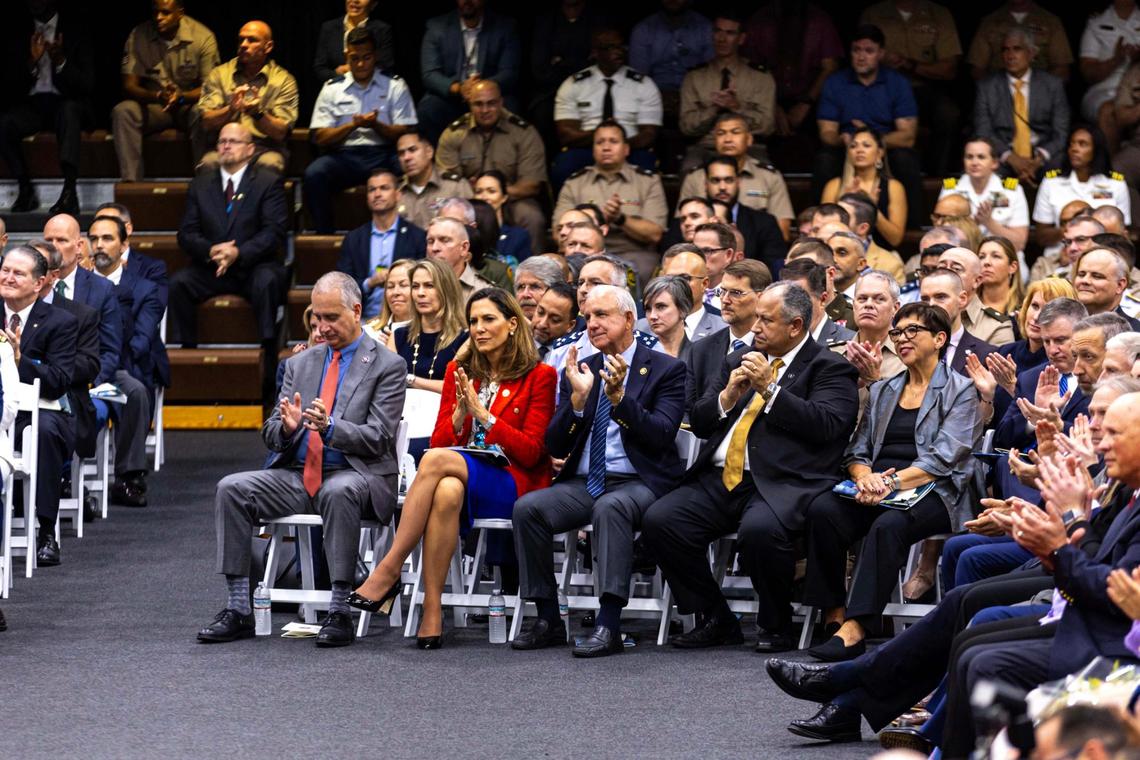 From left to right, Florida U.S. representatives Mario Díaz-Balart, Maria Elvira Salazar and Carlos Giménez react as U.S. Secretary of Defense Lloyd J. Austin III presides over the change of command ceremony at the U.S. Southern Command in Doral.