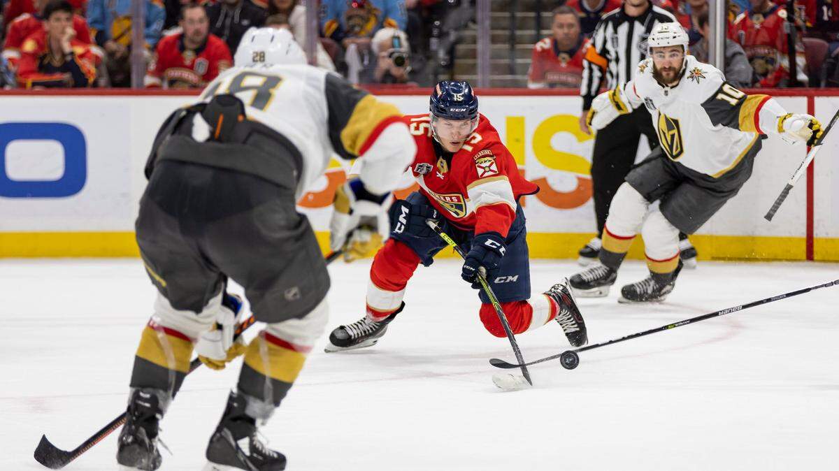 Florida Panthers center Anton Lundell (15) tries to take a shot toward the goal as Vegas Golden Knights left wing William Carrier (28) defends in the third period of Game 4 of the NHL Stanley Cup Final at the FLA Live Arena on Saturday, June 10, 2023, in Sunrise, Fla.