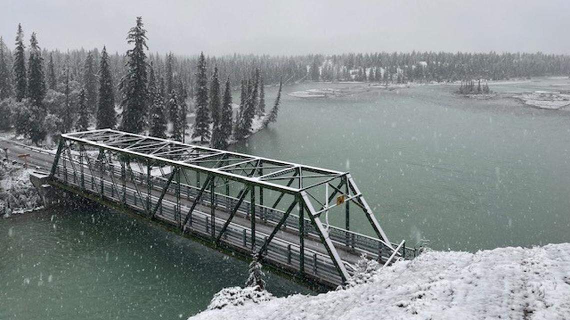 Heavy snow fell in Alberta, stranding 60 visitors from a national park. Photos show the surreal summer weather.