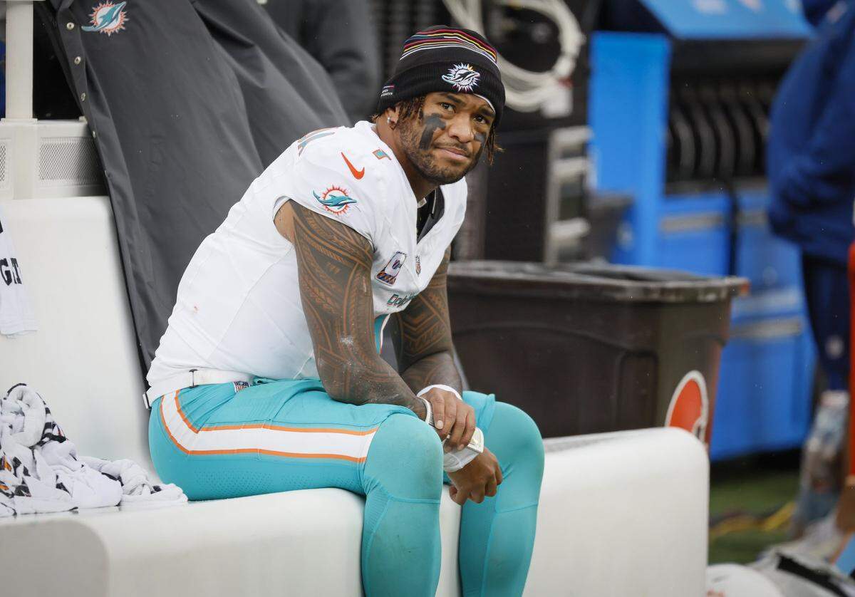 Miami Dolphins quarterback Tua Tagovailoa (1) sits out the rest of the game late in the second half of an NFL football game at Huntington Bank Field in Cleveland, Ohio, on Sunday, October 19, 2025.