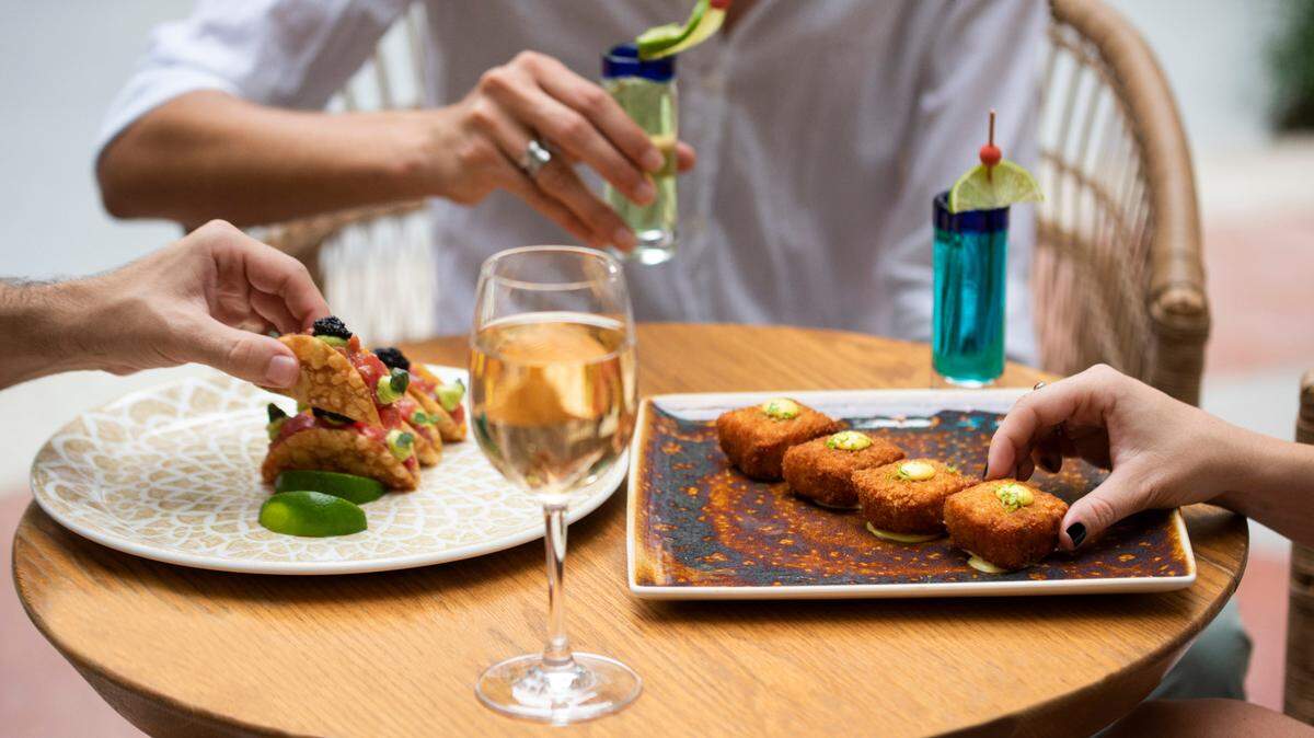 Ahi tuna tacos with a dollop of caviar, at left, are one of the specialties of the new Mehzcla restaurant at The Balfour Hotel in South Beach.