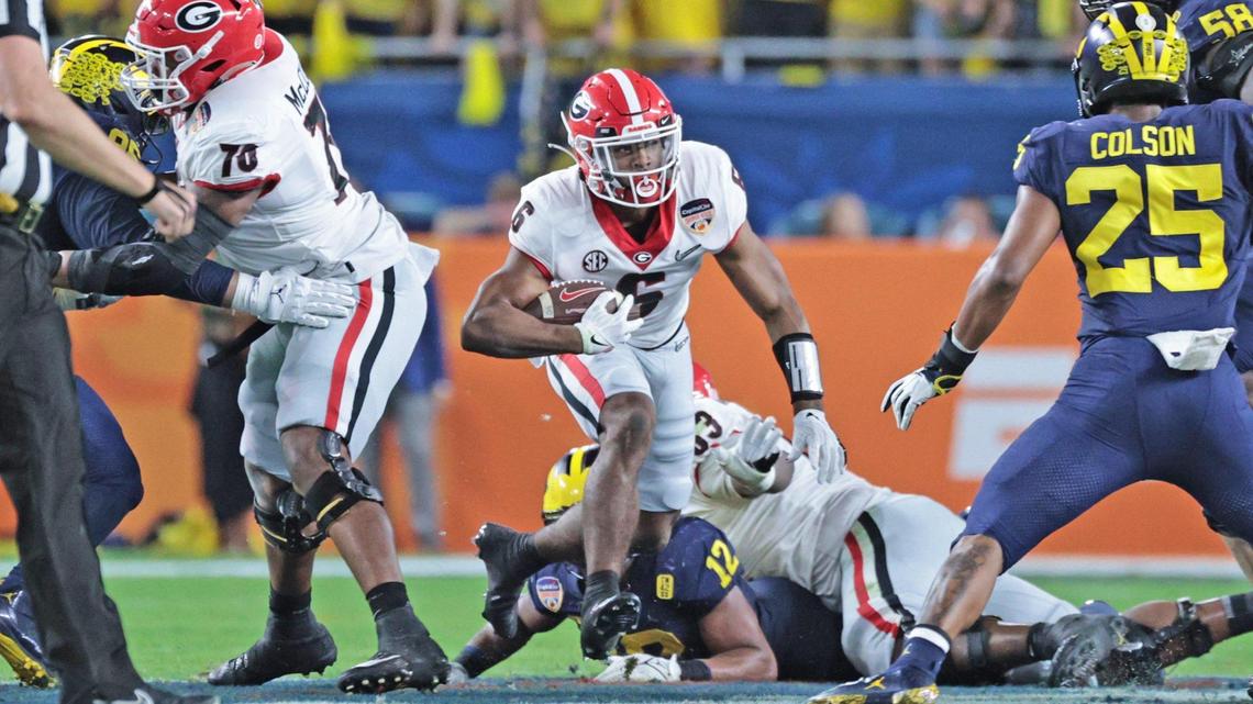 Georgia Bulldogs running back Kenny McIntosh (6) runs in the fsecond quarter against Michigan Wolverines during the 2021 College Football Playoff Semifinal at the Capital One Orange Bowl hosted at Hard Rock Stadium in Miami Gardens, Florida, on Friday, December 31, 2021.