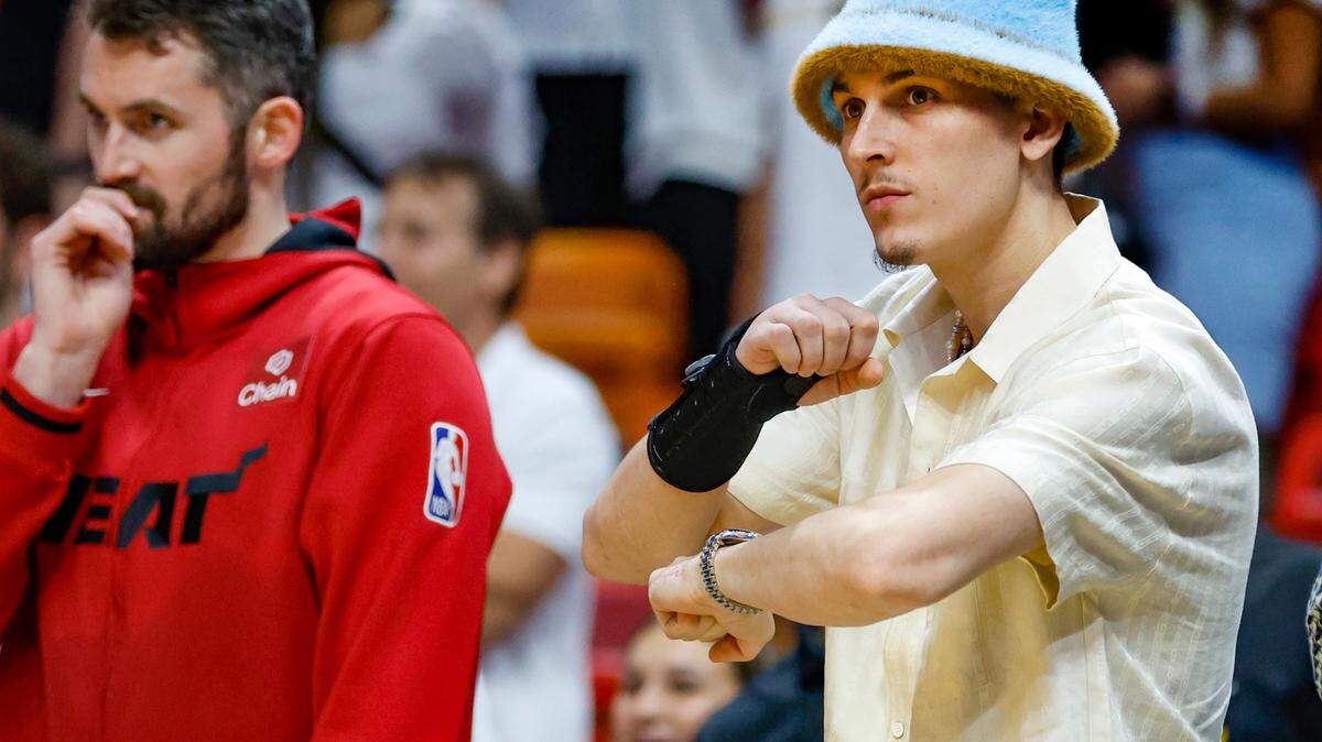 An injured Miami Heat guard Tyler Herro (14) signals a traveling call on the New York Knicks in the fourth quarter in Game 3 of the NBA Eastern Conference Semifinals at the Kaseya Center in Miami on Saturday, May 6, 2023.