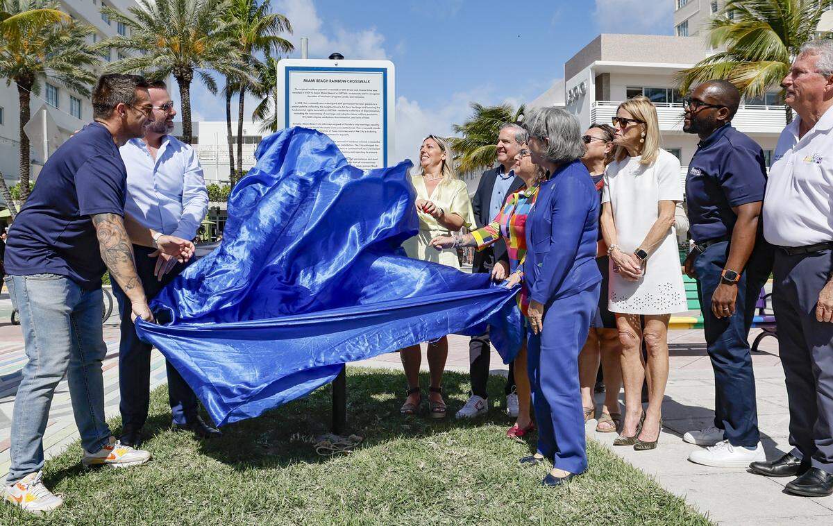 Miami Beach officials and community members gathered at Lummus Park for the unveiling of a rebuilt LGBTQ+ crosswalk made of 3,606 colorful pavers on Friday, April 10, 2026. The installation was created less than six months after the Florida Department of Transportation removed the original crosswalk at 12th Street and Ocean Drive in Miami Beach, Florida.