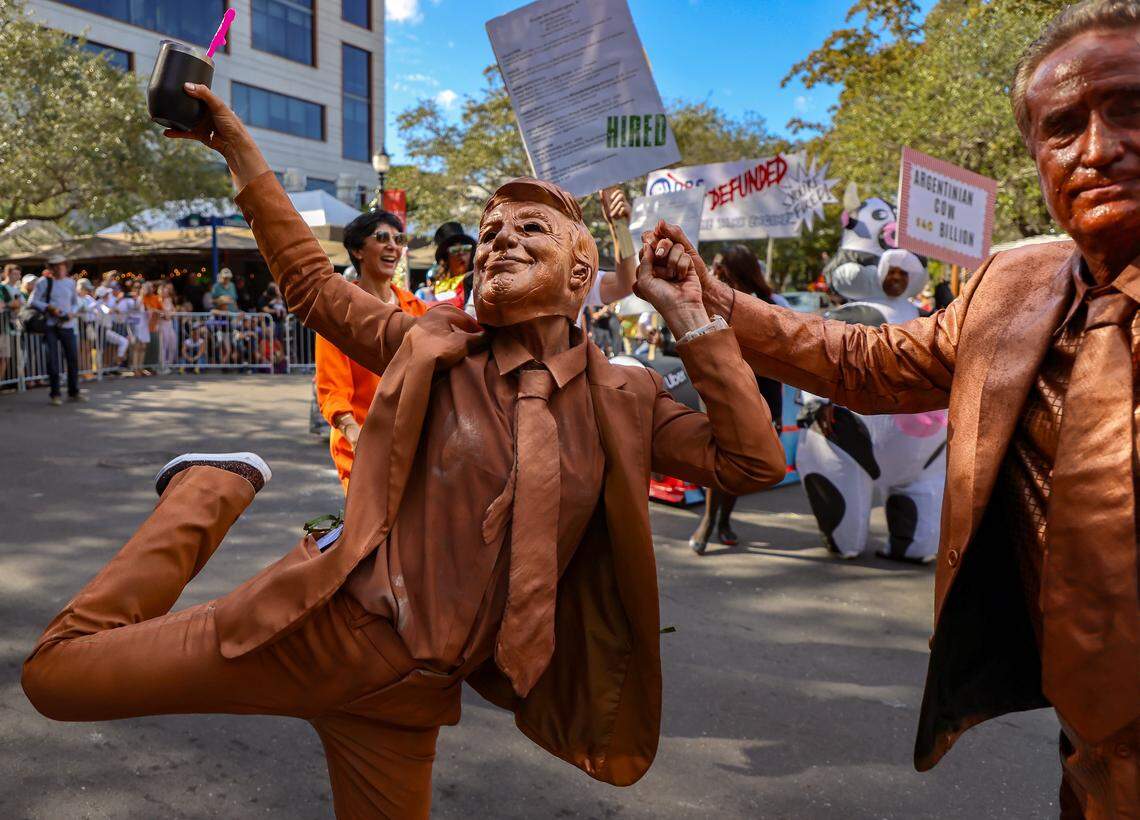 The Trump Epstein Friendship Statue is a source of parody during the 42nd Annual King Mango Strut - a wacky, fun-filled parade celebrating the quirks, humorous, and satirical political statements held on Sunday, January 4, 2026, in the heart of the Grove in Miami, Florida.