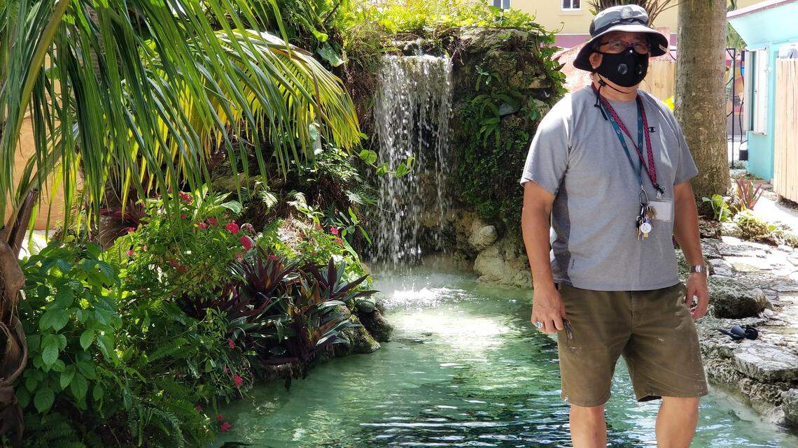 Michael Hoo, owner of the Hoosville Hostel in Florida City, stands near the fresh-water pool at the rear of the property on July 15, 2020. Hoo has been making extensive renovations to the hostel since he bought it two years ago, but he says business has dropped 80 percent due to COVID-19.