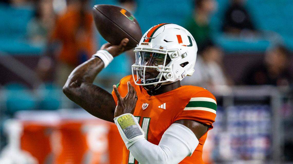 Miami Hurricanes quarterback Jacurri Brown (11) throws the ball before the first quarter of an ACC college football game against Clemson University at Hard Rock Stadium in Miami Gardens, Florida, on Saturday, October 21, 2023.
