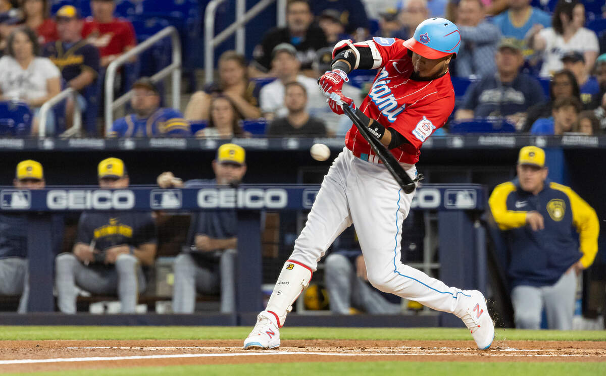 Miami Marlins second baseman Luis Arraez (3) hits a single against the Milwaukee Brewers in the first inning of an MLB game at loanDepot park on Saturday, Sept. 23, 2023, in Miami, Fla.