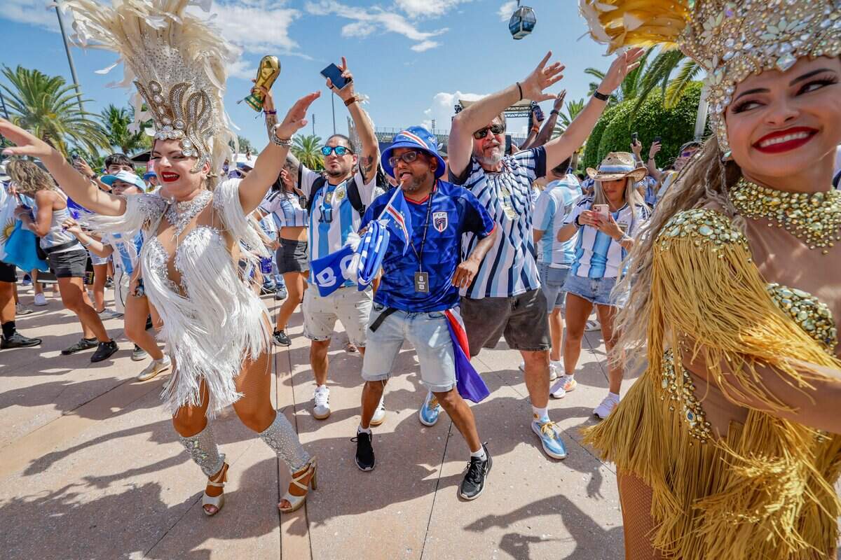 Cape Verde fan Darcy Neves joins performers dancing in the crowd before the start of the FIFA World Cup 2026 Round of 32 soccer match between Argentina and Cape Verde at Hard Rock Stadium (Miami Stadium) on Friday, July 3, 2026, in Miami Gardens, Fla.