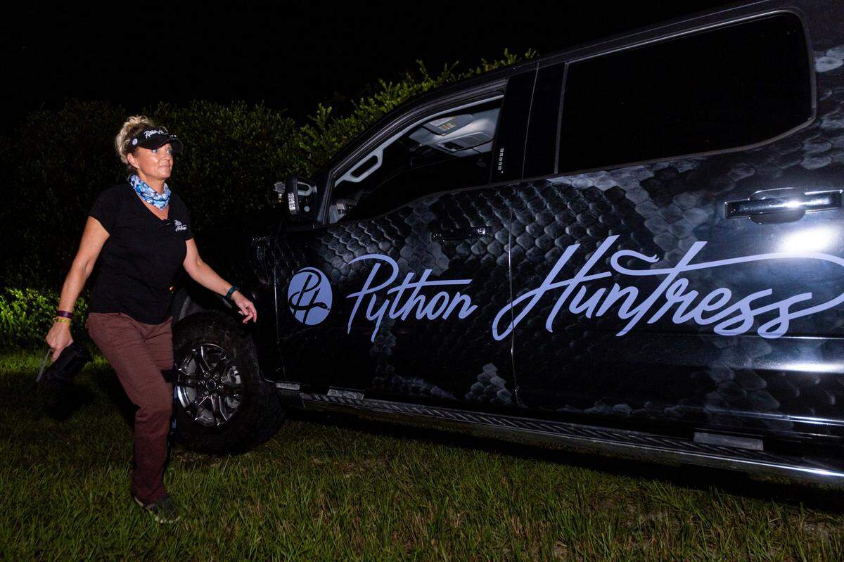 Python Huntress Amy Siewe walks to her truck during a hunting trip down Tamiami Trail on Thursday, September 5, 2024, in Miami, Fla.