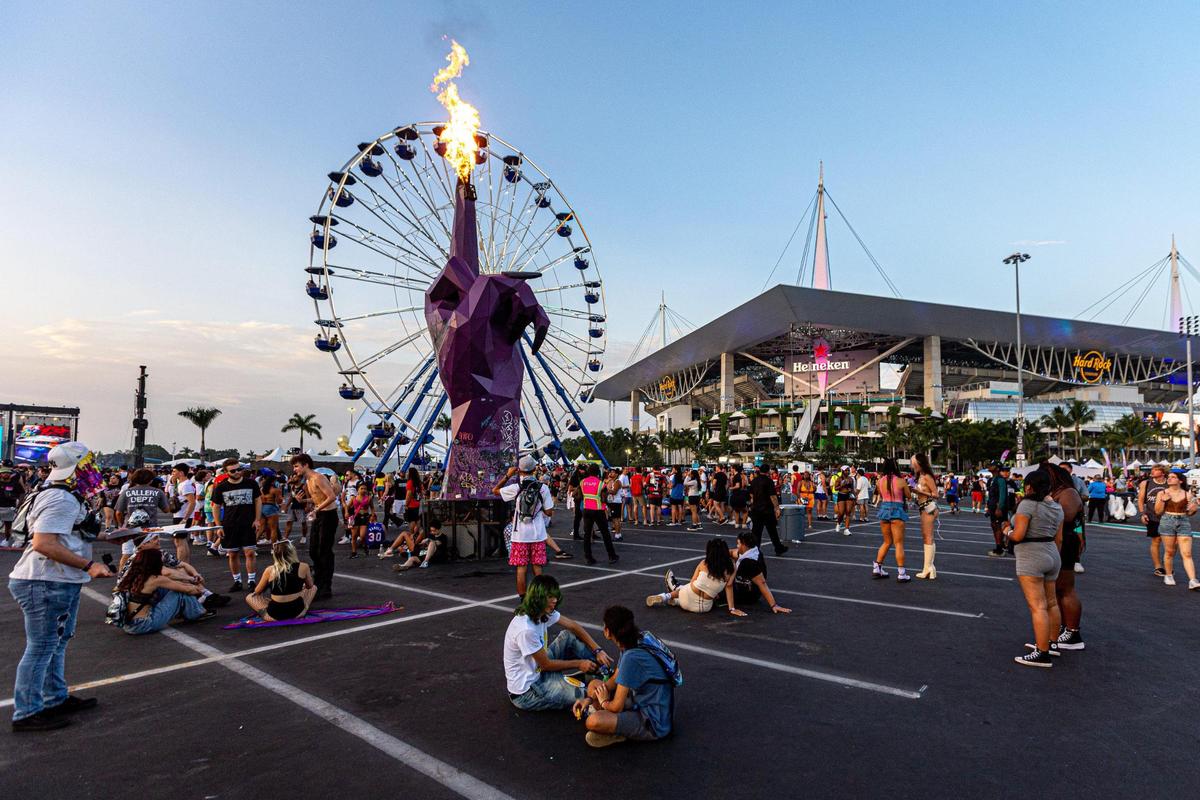 Attendees hang around the festival grounds during day two of Rolling Loud Miami 2023 at Hard Rock Stadium in Miami Gardens, Florida, on Saturday, July 22, 2023.
