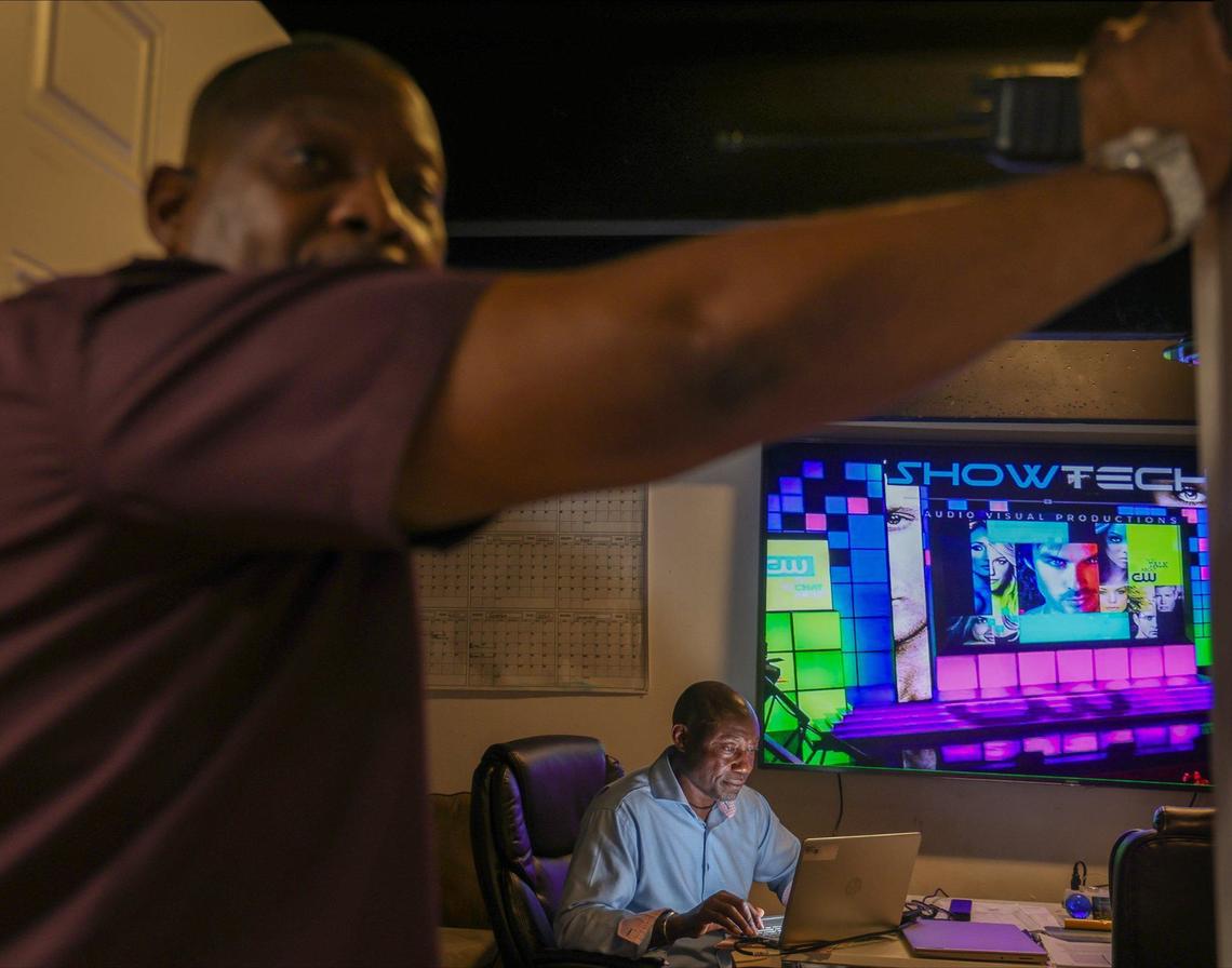 Joe Louissaint, 54, center, runs a AV production company out of his warehouse in Miami Gardens, Florida, on Wednesday, Aug. 28, 2024. He operates an AV production business called Show Technology that produces events ranging from corporate meetings to festivals. Louissaint was the audiovisual director for multiple hotels throughout Miami before launching his company in 2000.