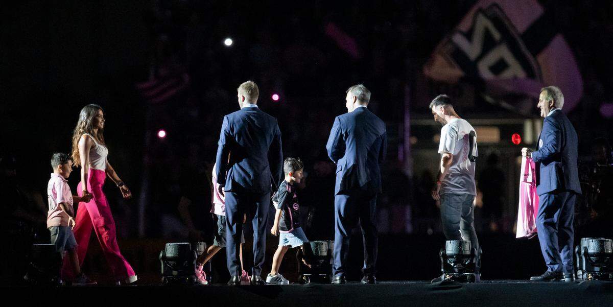 Lionel Messi’s wife, Antonela Roccuzzo, and sons, Thiago, Mateo and Ciro walk on the stage during Inter Miami’s The Unveil event at DRV PNK Stadium on Sunday, July 16, 2023, in Fort Lauderdale, Fla. The event was held to officially welcome Argentine forward Lionel Messi (10) and Spanish midfielder Sergio Busquets (5) to the team.