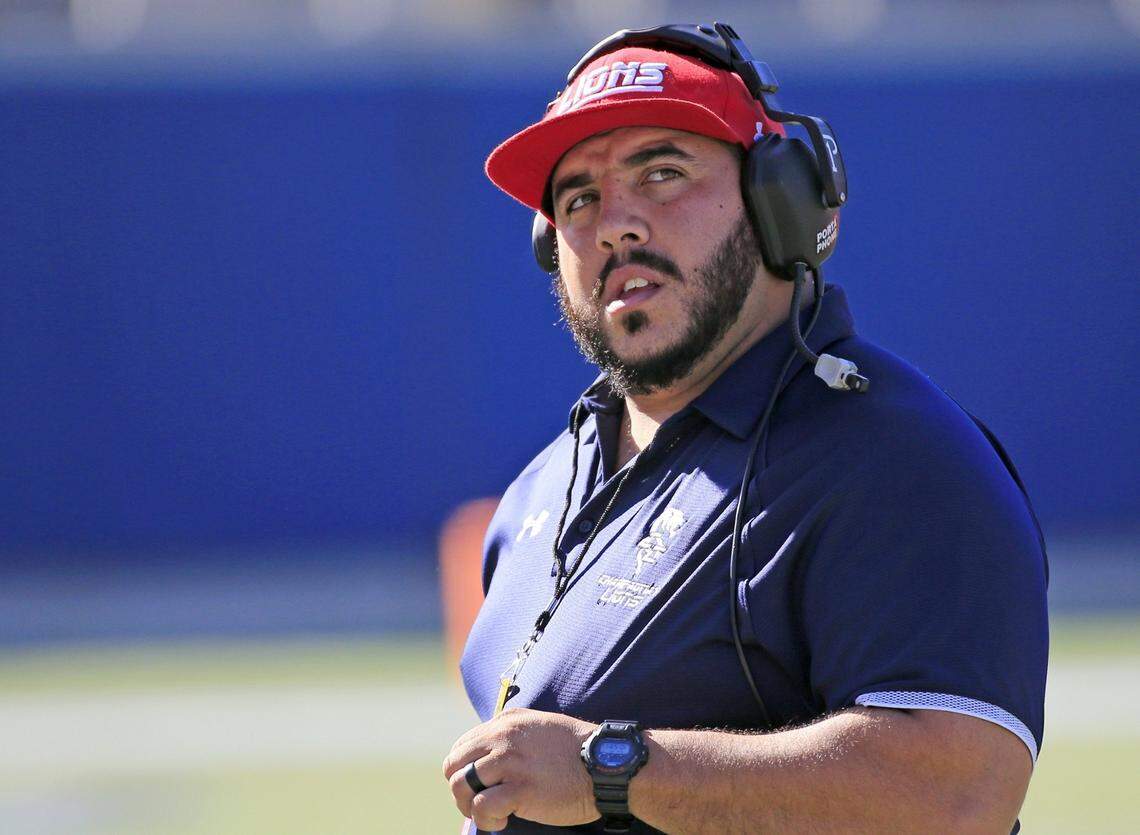 The Lions head coach Hector Clavijo, III looks on as Champagnat Lions play North Florida Christian Eagles in the Florida High School Athletic Association State Chapionships Class 2A at Camping World Stadium in Orlando on Friday, December 7, 2018.
