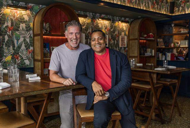 Co-owners Michael Simmons (left) and Derrick Fleming, posed in the bar at the Red Rooster restaurant located in the heart of Miami's historic Overtown neighborhood, on Friday, March 13, 2026.