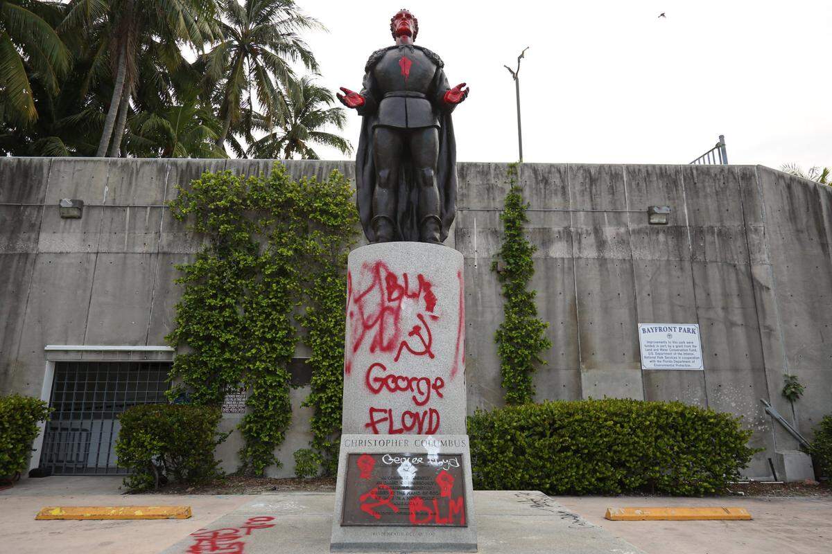 A vandalized statue of Christopher Columbus at Bayfront Park in downtown Miami, Wednesday, June 10, 2020.