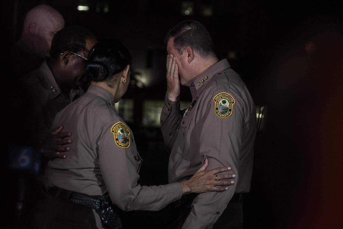 Miami-Dade Sheriff Rosie Cordero-Stutz comforts a member of her Command Staff during a press conference outside of the HCA Florida Kendall Hospital after Miami-Dade Deputy Devin Jaramillo was ambushed as he responded to a traffic accident and was shot to death, on Friday, Nov. 7, 2025.