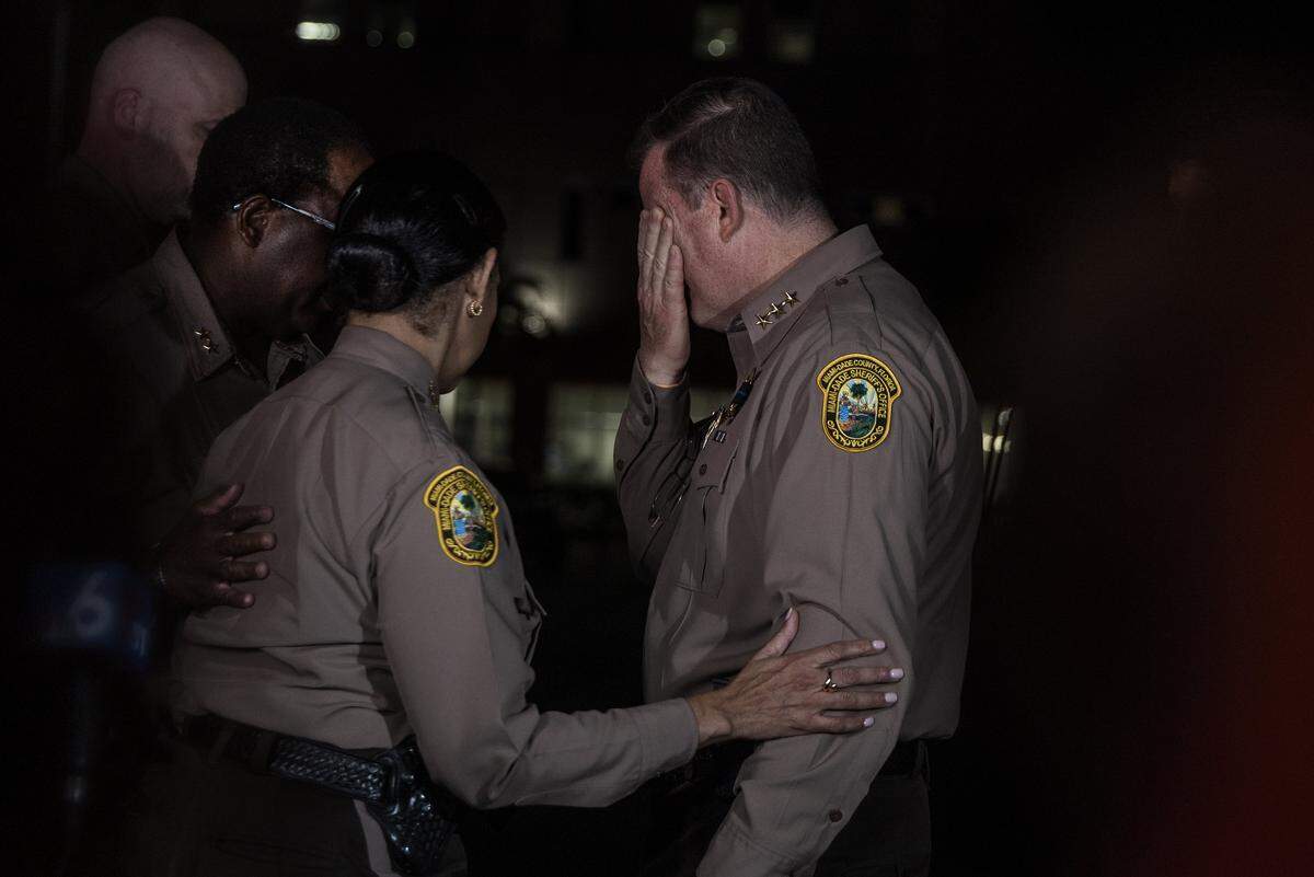Miami-Dade Sheriff Rosie Cordero-Stutz comforts a member of her command Staff  uring a press conference at HCA Florida Kendall Hospital after Miami-Dade Deputy Devin Jaramillo was ambushed as he responded to a traffic accident and was shot to death, on Friday November 7, 2025.