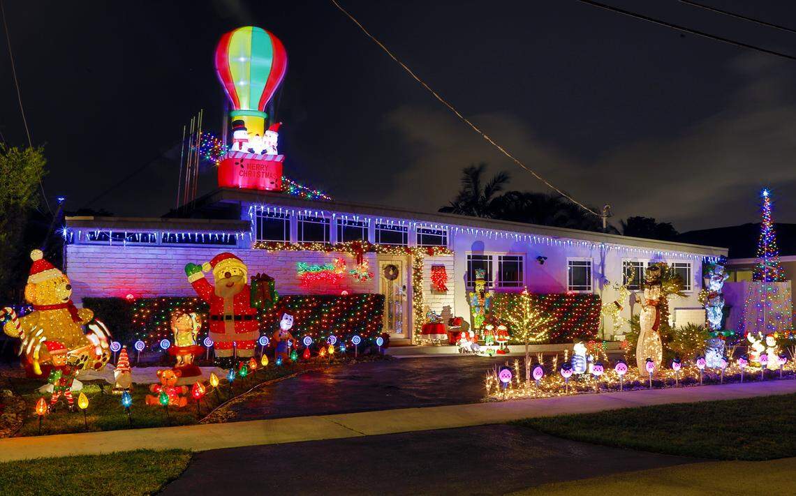 April and Leon Wegman’s house is fully decorated, complete with Frosty the Snowman in a hot-air balloon,  a life-size Santa and a backyard deck on the canal festooned with lights, 1900 S. Hibiscus Drive, North Miami.