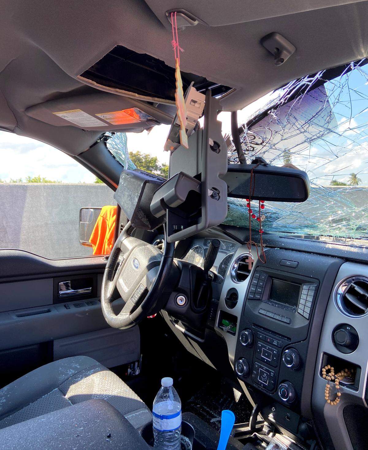 A passenger seat view of the metal in the windshield of a Ford truck Tuesday on I-95.