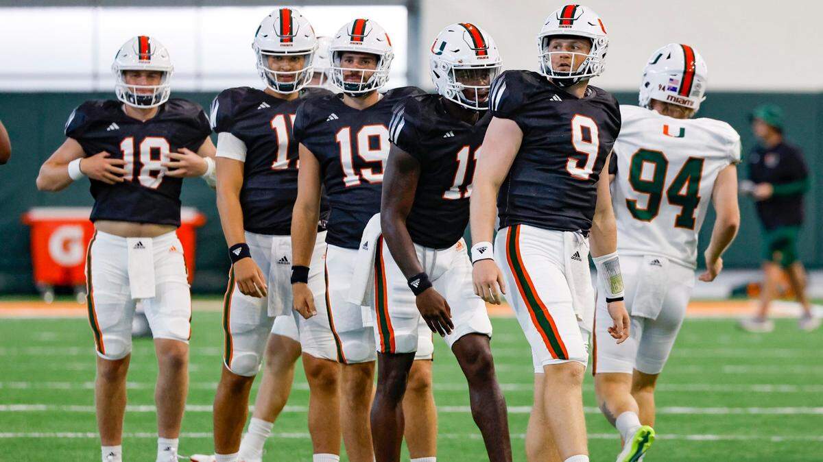 Miami Hurricanes quarterback Tyler Van Dyke leads the team during warmups at the Carol Soffer Indoor Practice Facility at the University of Miami in Coral Gables on Wednesday, August 9, 2023.
