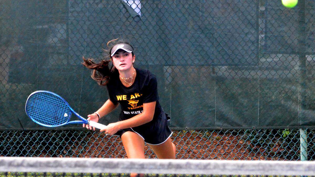 Natalie Block from American Heritage Plantation watches her shot clear the net during a No. 1 singles team semifinals match against Valentina Rossi from Gulliver Prep at the FHSAA Class 2A meet at Red Bug Lake Park in Casselberry on Thursday (April 29, 2021).