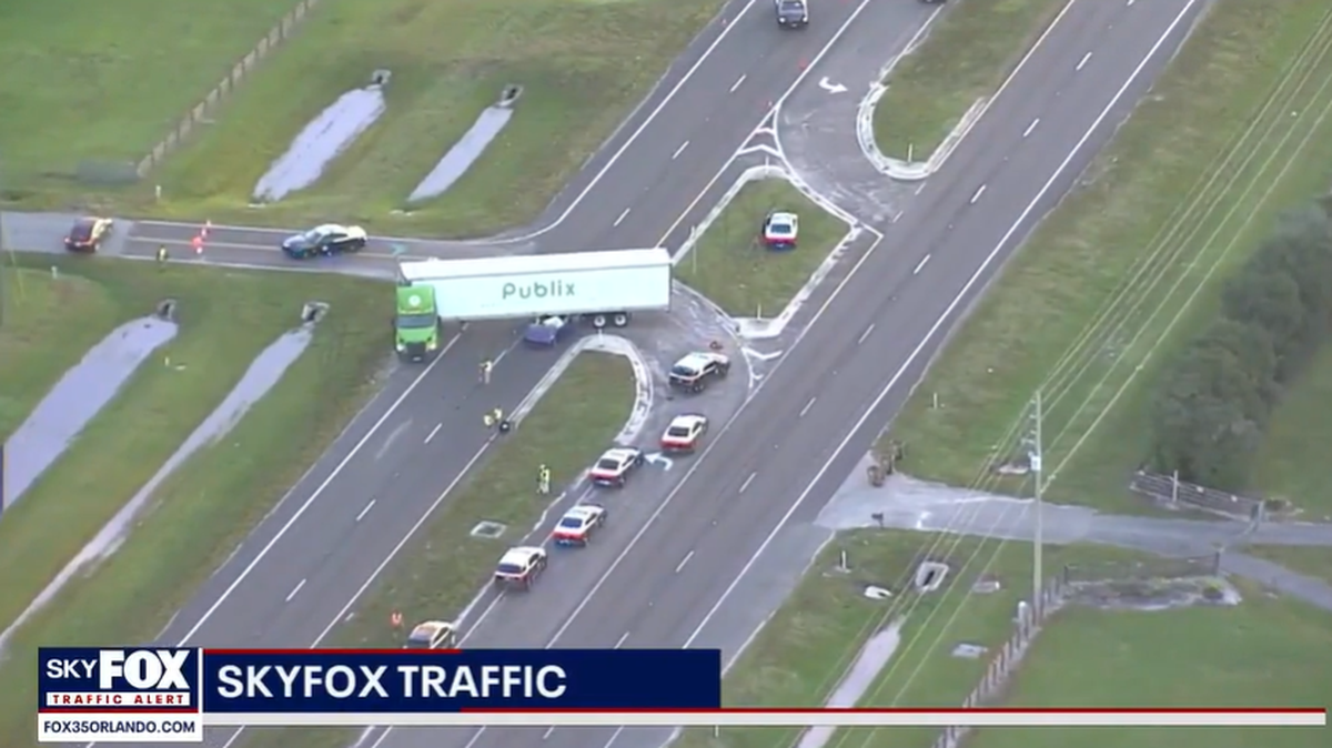 The car became lodged underneath the trailer of the semi in the crash, Florida Highway Patrol said.