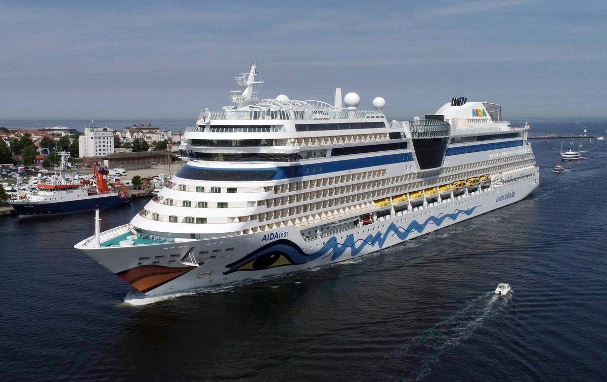 The AIDAmar cruise ship enters the channel in Rostok, Germany on July 18, 2020. On July 24, ten crew members from the AIDAmar and AIDAblu ships tested positive for COVID-19. The company plans to resume cruises in August.