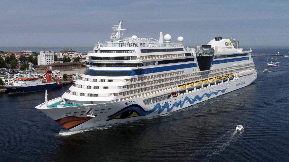 The AIDAmar cruise ship enters the channel in Rostok, Germany on July 18, 2020. On July 24, ten crew members from the AIDAmar and AIDAblu ships tested positive for COVID-19. The company plans to resume cruises in August.