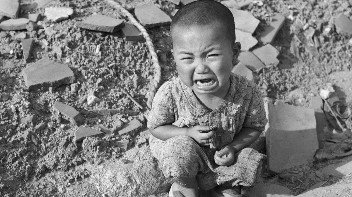 A Japanese child cries amid the rubble of Hiroshima, a year after the city was devastated by the world’s first atomic bomb attack, on Aug. 6, 1945.