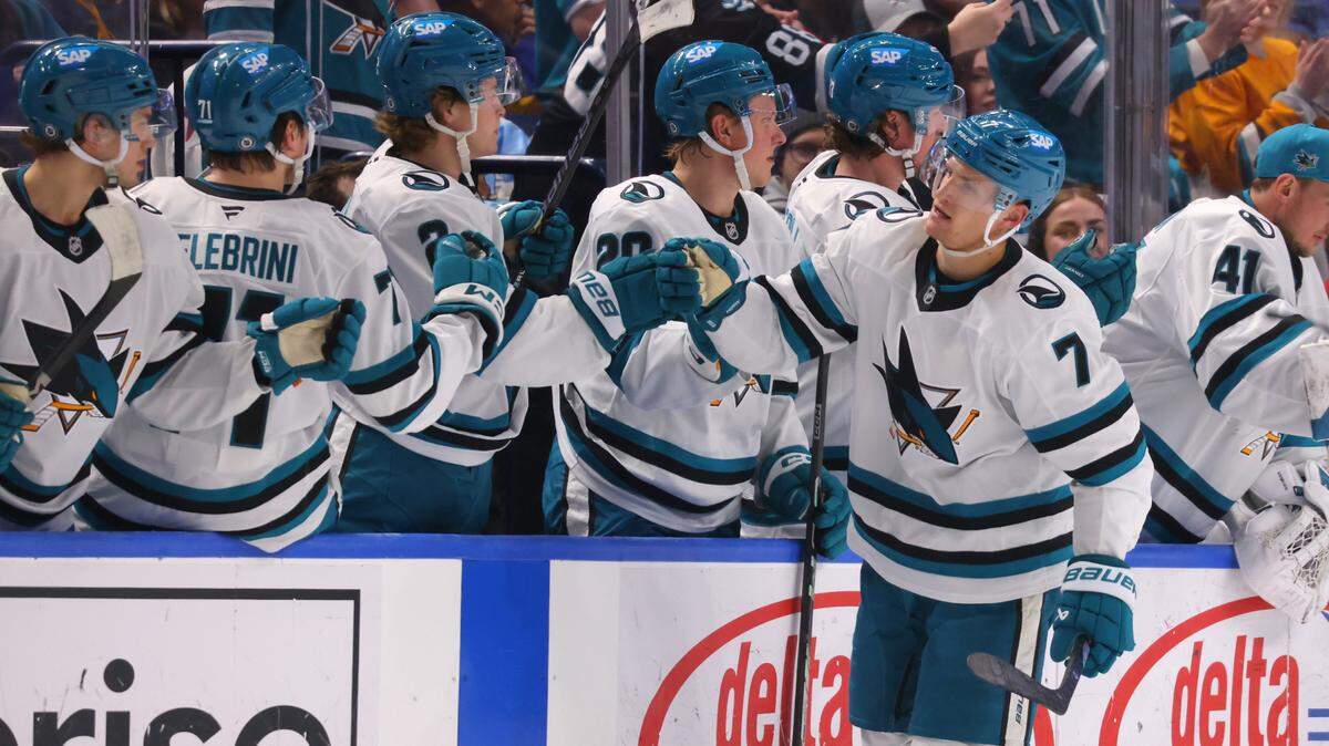 Mar 4, 2025; Buffalo, New York, USA; San Jose Sharks center Nico Sturm (7) celebrates his goal with teammates during the second period against the Buffalo Sabres at KeyBank Center. Mandatory Credit: Timothy T. Ludwig-Imagn Images