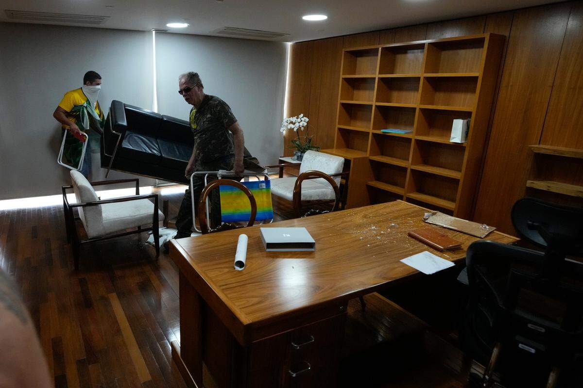 Protesters, supporters of Brazil’s former President Jair Bolsonaro, ransack an office after storming the Planalto Palace in Brasilia, Brazil.