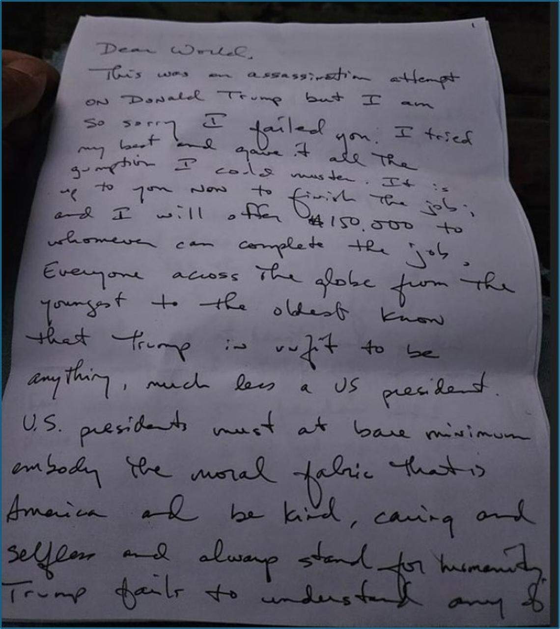 Federal prosecutors say a witness contacted investigators to share this letter left inside a box dropped off by Ryan Wesley Routh months before Routh was detained on Sept. 15, 2024, and accused of hiding in the bushes at Trump International Golf Club West Palm Beach with a rifle as Trump played a round of golf. 