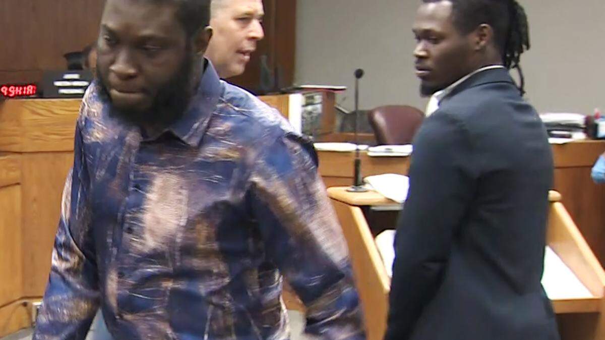Miami, Florida, May 3, 2024 - FRAME GRAB FROM VIDEO PROVIDED BY WSVN CH. 7 Michelson Romelus, left and Bendjy Charles, right, turn away from the judge as they leave the courtroom this morning in Miami Dade County Criminal Court.
