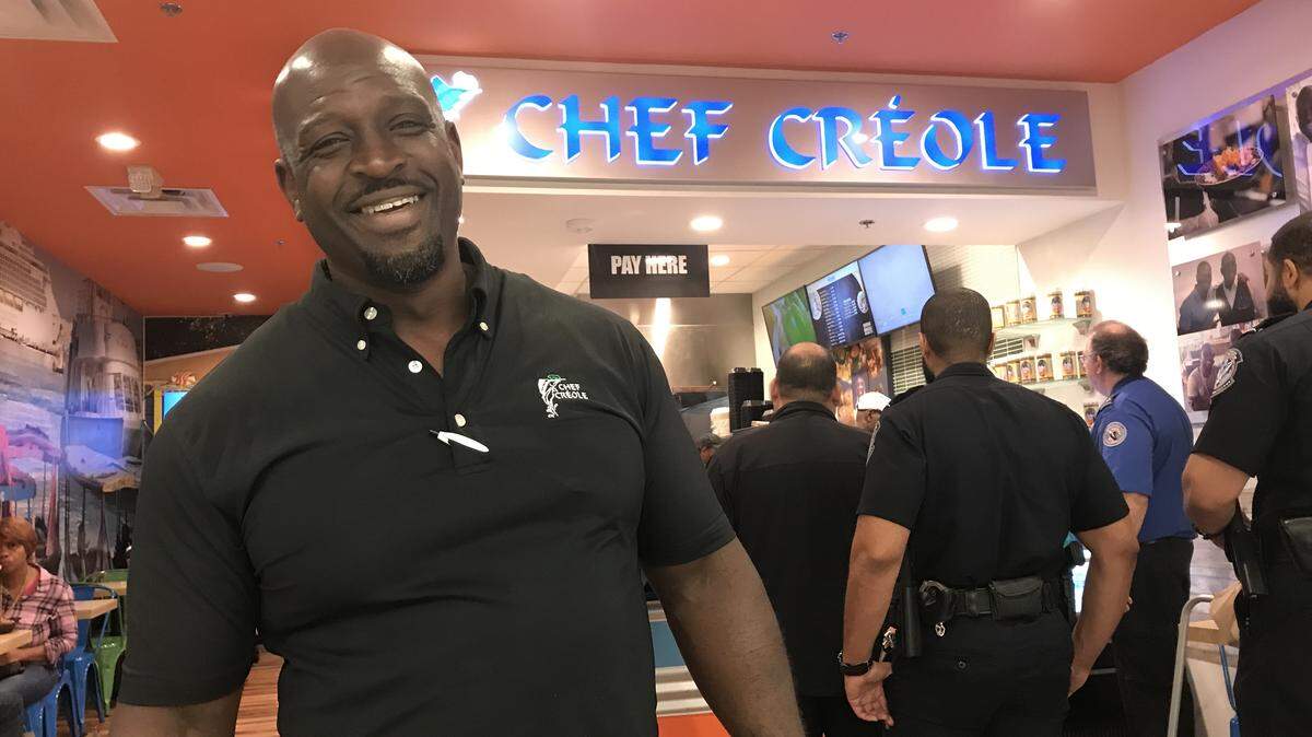 Chef Creole owner Wilkinson Sejour outside the Haitian restaurant’s location at Miami International Airport. On Monday, the restaurant began offering free lunch and dinner to federal employees working at MIA without pay during the federal shutdown. By 7 p.m., the restaurant had given more than 300 meals. Photograph taken on Monday, Jan. 14, 2019.