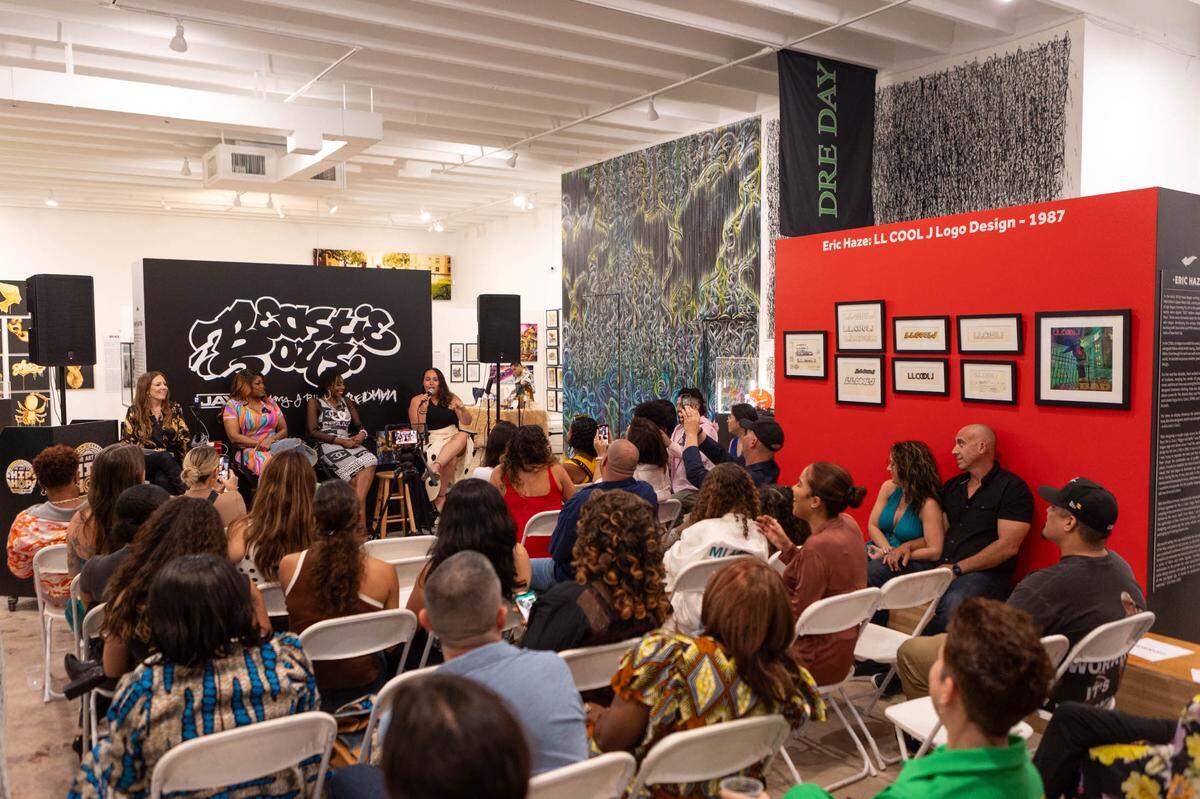 A crowd listens to a panel of female Miami radio legends Supa Cindy, Stichiz and Lucy Lopez at The Art of Hip Hop in Wynwood in celebration of Women’s History Month.