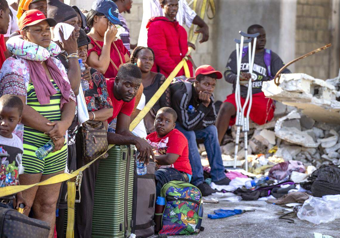 Evacuees wait for transportation to leave Marsh Harbour Port on Abaco Island on Saturday, September 7, 2019.