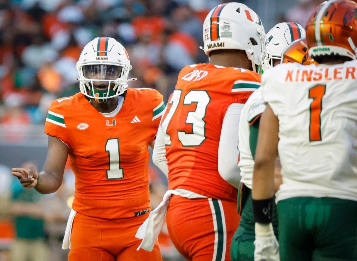 Miami Hurricanes quarterback Cam Ward (1) gestures in the huddle during the game against the Florida A&M Rattlers at Hard Rock Stadium in Miami Gardens, Florida, on Saturday, September 7, 2024.