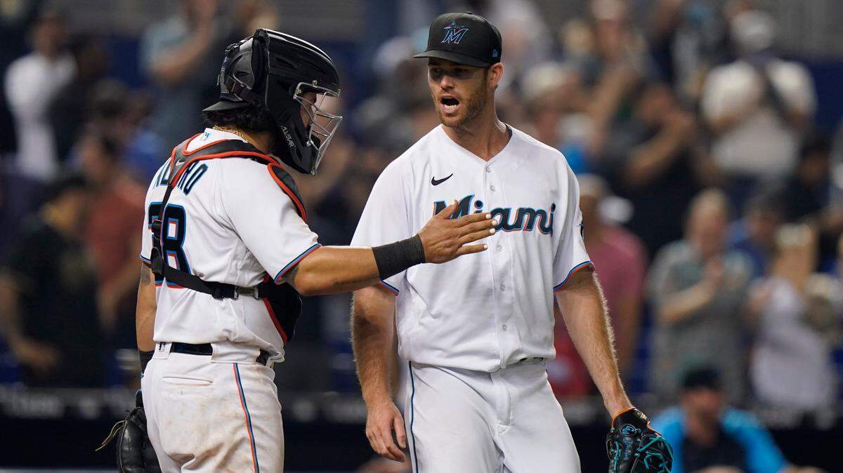 Miami Marlins catcher Jorge Alfaro, left, and relief pitcher Anthony Bender celebrate after they defeated the Los Angeles Dodgers in a baseball game, Monday, July 5, 2021, in Miami. (AP Photo/Wilfredo Lee)