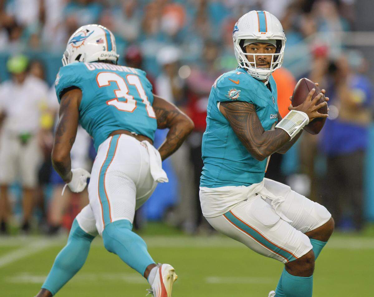 Miami Dolphins quarterback Tua Tagovailoa (1) sets up to pass in the first quarter during an NFL football game against the Jacksonville Jaguars at Hard Rock Stadium in Miami Gardens, Florida, on Saturday, August 23, 2025. 